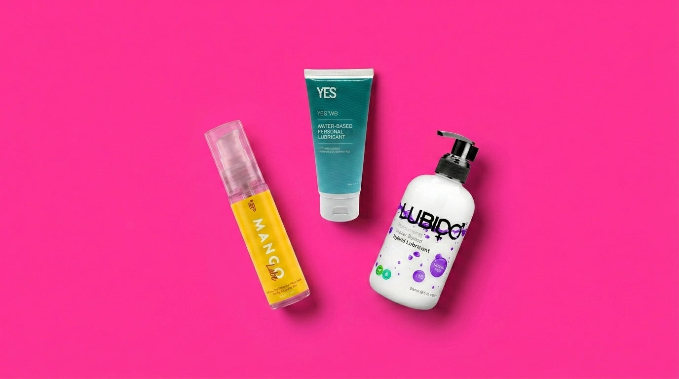Three lubricant bottles arranged on a vivid pink background — a clean flat-lay hero for a personal lubricant guide