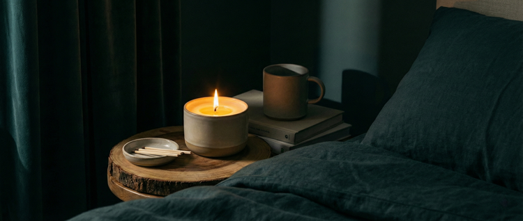 Luxury aromatherapy massage candle melting into warm, skin-nourishing oil, styled in a cozy and romantic wellness setting.