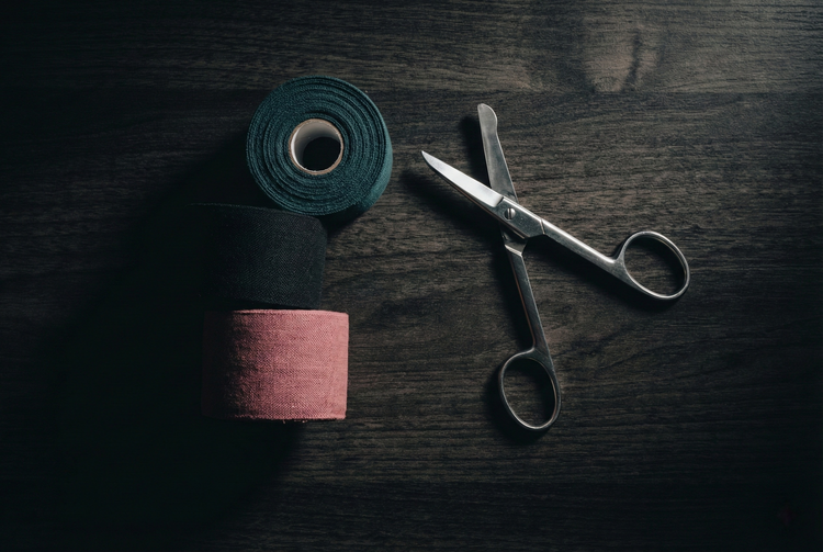 Premium PVC bondage tape and non-sticky self-adhesive restraints, styled as luxury fetish accessories.