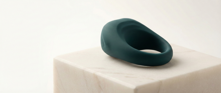 Premium cock rings and vibrating couples' enhancers, styled as luxury accessories in a sophisticated setting.