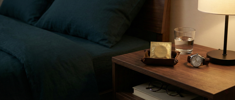 Premium safe sex essentials and condoms, featuring vegan and latex-free options, styled in a clean and sophisticated wellness setting.