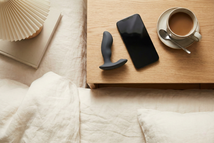 Ergonomically designed prostate massager and P-spot vibrator styled in a premium, high-tech wellness setting.